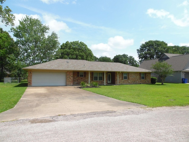 175 Isom St, Lumberton, TX 77657 - ranch-style home with an attached garage, driveway, and brick siding