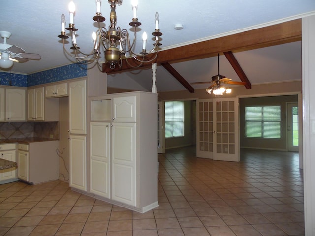 175 Isom St, Lumberton, TX 77657 - kitchen with a ceiling fan, light tile patterned floors, and a chandelier