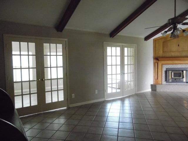 175 Isom St, Lumberton, TX 77657 - unfurnished living room featuring french doors, tile patterned flooring, ceiling fan, and a fireplace
