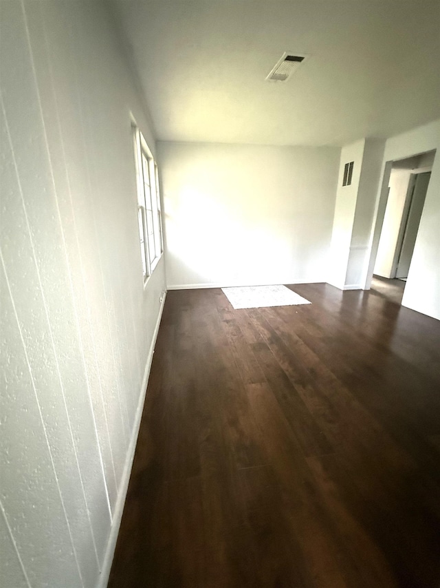 5335 Landry Ln, Beaumont, TX 77708 - empty room with dark wood-style floors and baseboards