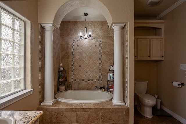 bathroom featuring tiled bath, a healthy amount of sunlight, a chandelier, and ornamental molding