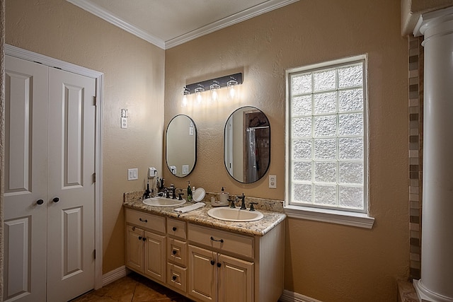 bathroom with ornate columns, ornamental molding, tile patterned flooring, and vanity