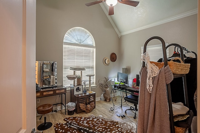 office space with ceiling fan, high vaulted ceiling, ornamental molding, and light hardwood / wood-style floors