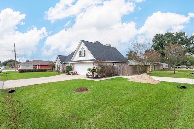 view of front of home with a garage and a front yard