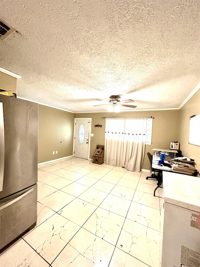 unfurnished office featuring a textured ceiling, ceiling fan, and crown molding