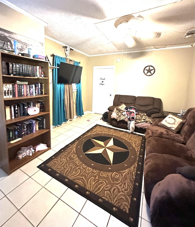 tiled living room featuring ornamental molding and a textured ceiling