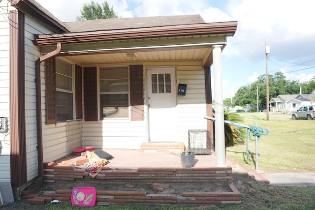 1720 Elgie St, Beaumont, TX 77705 - doorway to property featuring a yard and roof with shingles