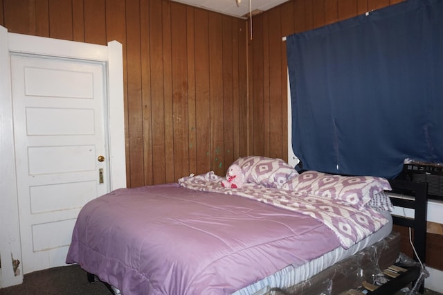 1720 Elgie St, Beaumont, TX 77705 - bedroom with wood walls and carpet