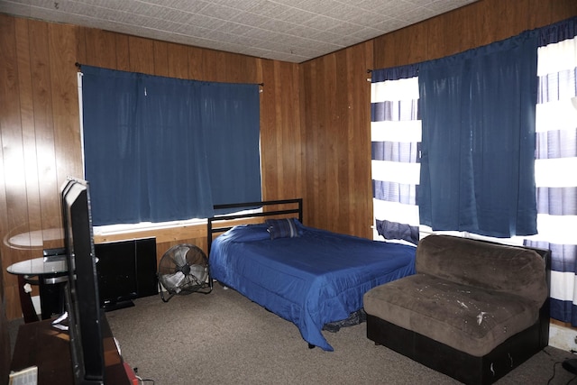 1720 Elgie St, Beaumont, TX 77705 - bedroom featuring wooden walls and carpet floors