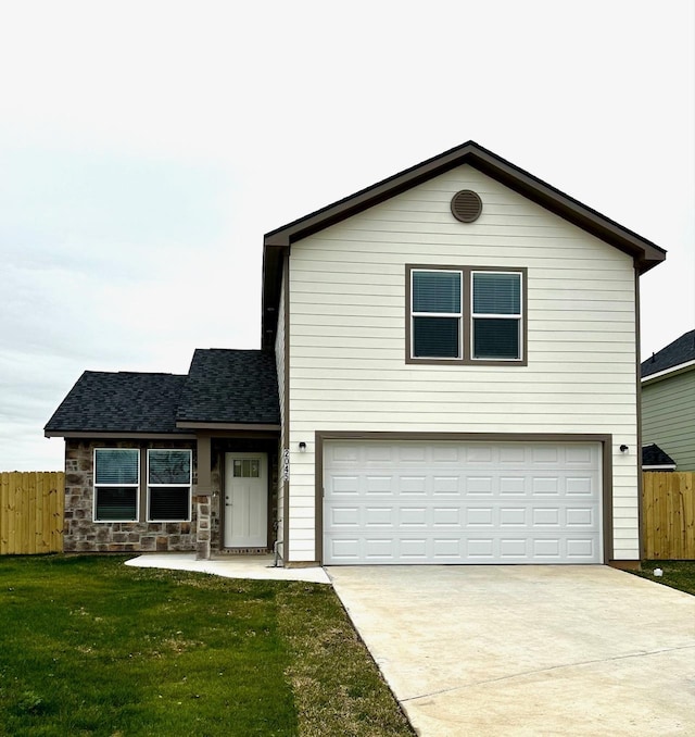 front of property with a garage and a front lawn