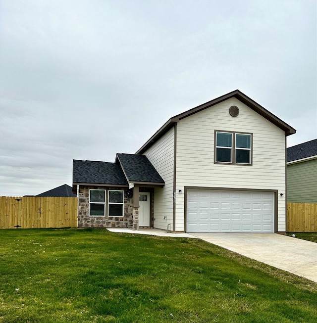 view of front of house with a garage and a front lawn