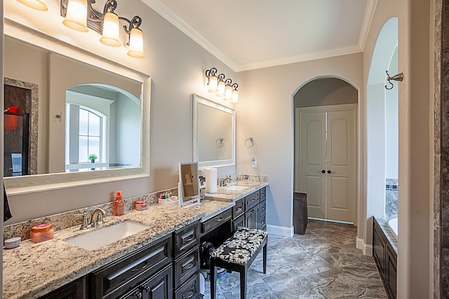 3570 Mystic Ln, Beaumont, TX 77713 - bathroom featuring double vanity, ornamental molding, a bathtub, and baseboards