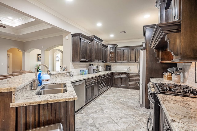 3570 Mystic Ln, Beaumont, TX 77713 - kitchen with a sink, stainless steel appliances, crown molding, dark brown cabinets, and backsplash