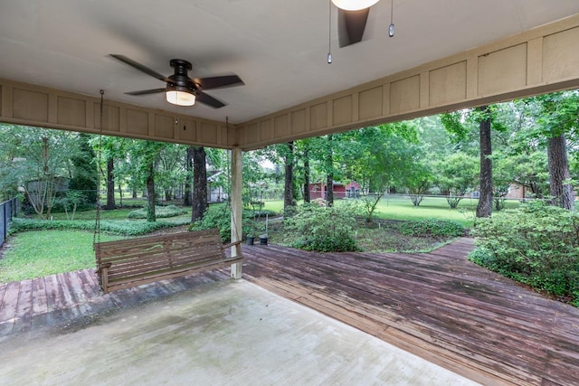 view of patio featuring a ceiling fan, a wooden deck, and a fenced backyard