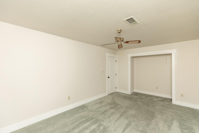 unfurnished room with baseboards, visible vents, ceiling fan, and light colored carpet