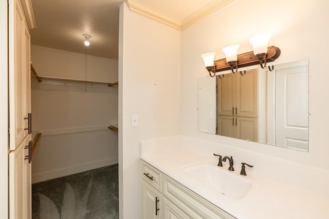 bathroom with crown molding and vanity