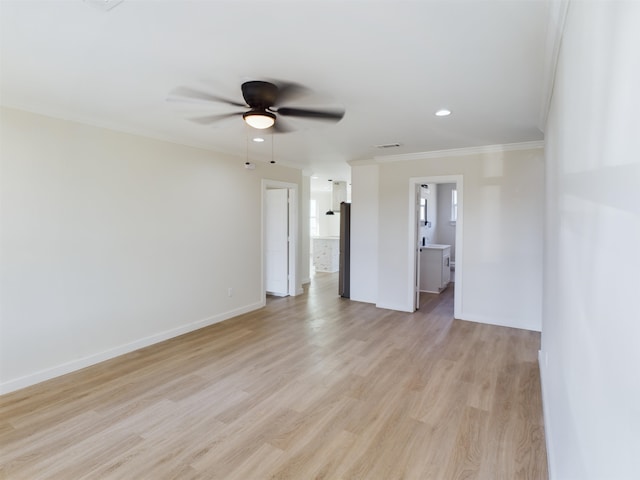 unfurnished room with crown molding, ceiling fan, and light hardwood / wood-style flooring