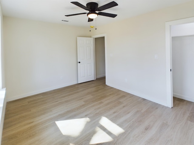 unfurnished bedroom featuring ceiling fan and light wood-type flooring