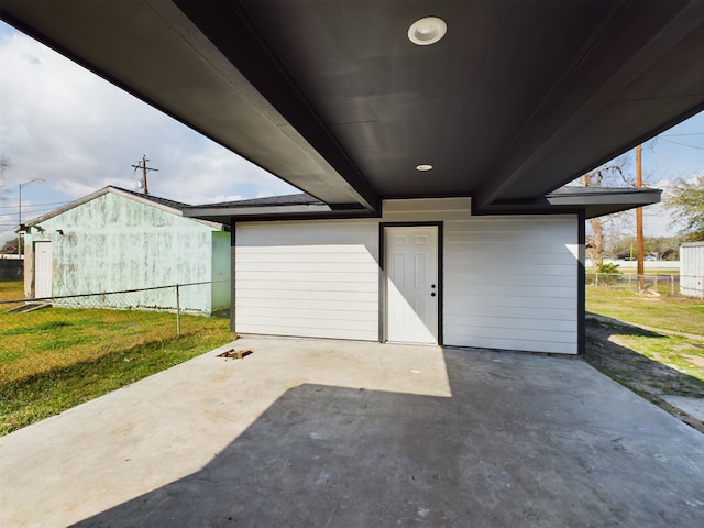 garage featuring a yard