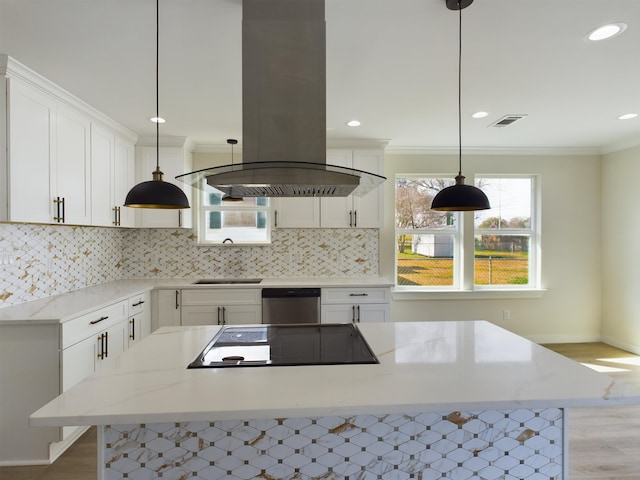 kitchen featuring light stone counters, black electric stovetop, island range hood, white cabinets, and stainless steel dishwasher