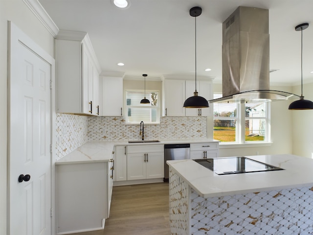 kitchen featuring sink, dishwasher, pendant lighting, island exhaust hood, and white cabinets