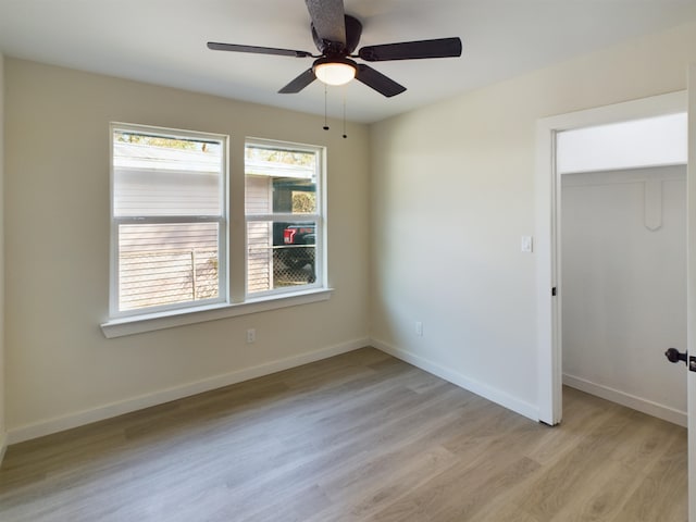 unfurnished room with ceiling fan and light hardwood / wood-style floors