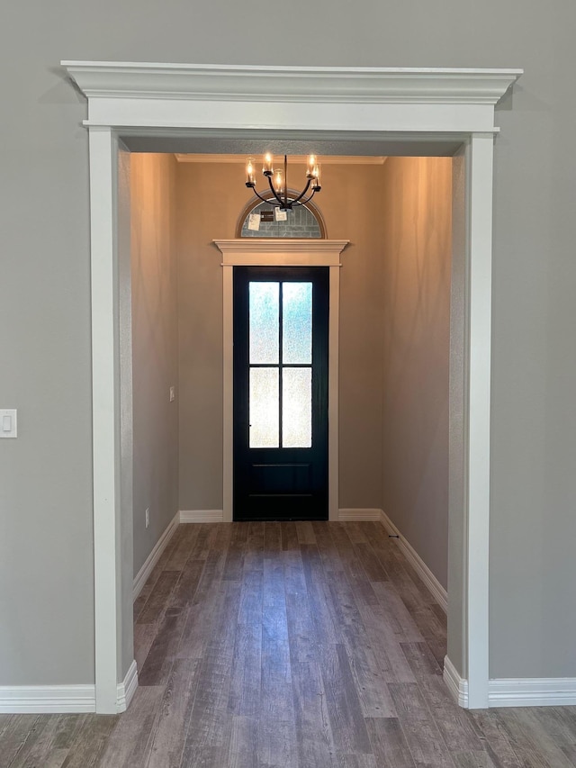 interior space featuring a notable chandelier and wood-type flooring