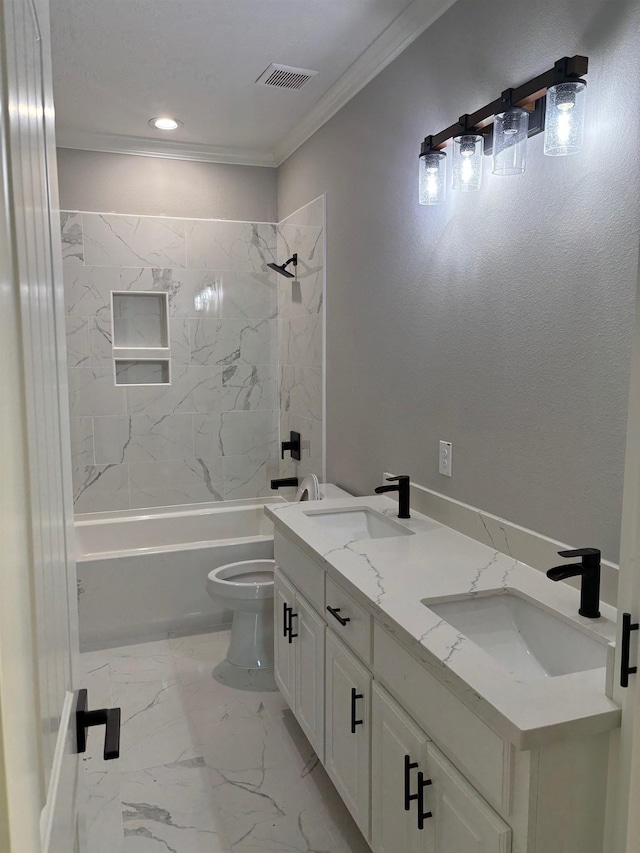 full bathroom with vanity, toilet, ornamental molding, and tiled shower / bath