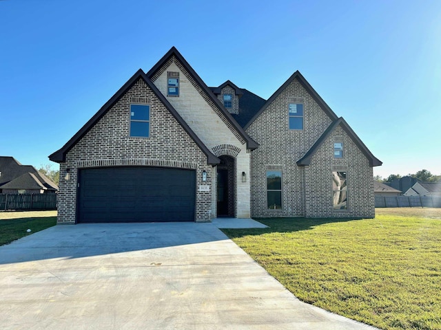 french provincial home featuring a front yard