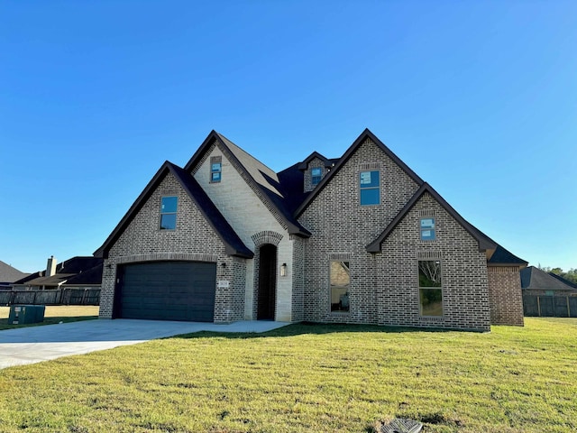 view of front facade featuring a front yard and a garage