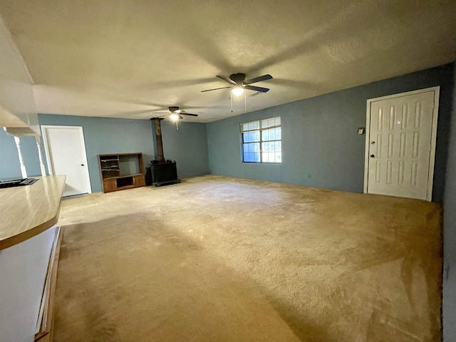 unfurnished living room featuring ceiling fan