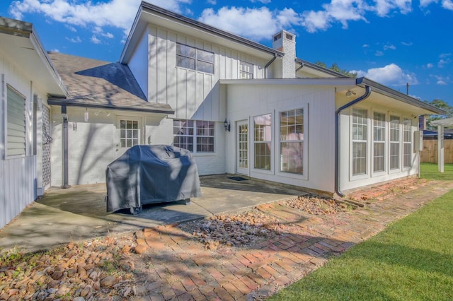 back of property with a patio area