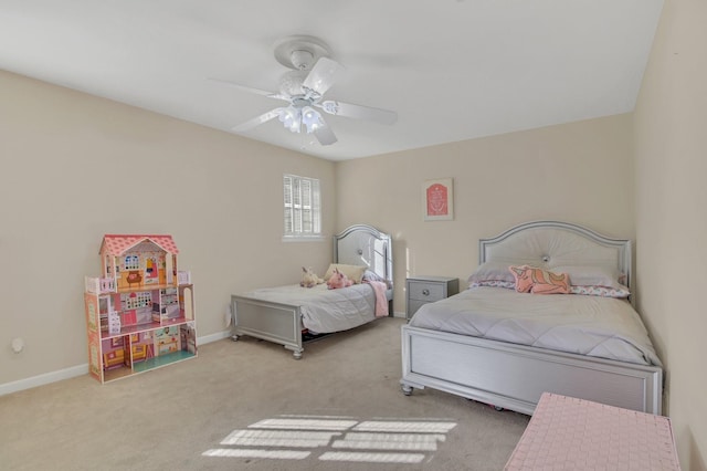 bedroom with ceiling fan and light colored carpet