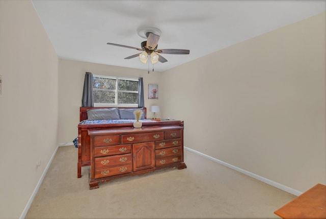 bedroom featuring ceiling fan and light colored carpet