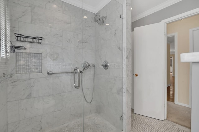 bathroom with tile patterned floors, an enclosed shower, and crown molding