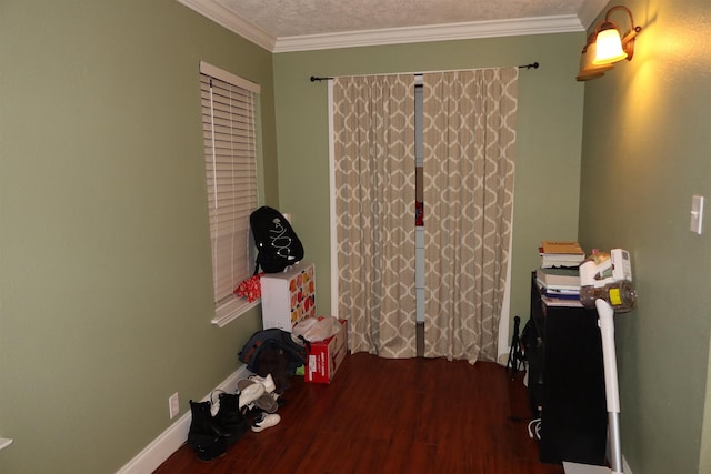 miscellaneous room with hardwood / wood-style floors, a textured ceiling, and crown molding