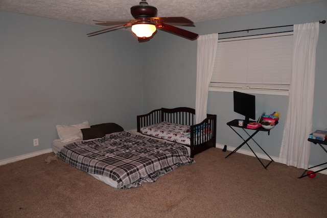 bedroom featuring carpet, ceiling fan, and a textured ceiling