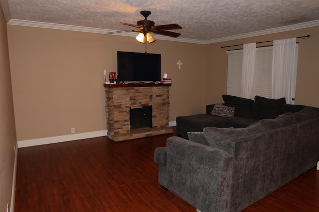 living room featuring ceiling fan, a fireplace, dark hardwood / wood-style floors, and a textured ceiling