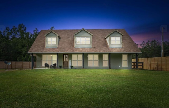 view of front of home featuring a fenced backyard and a front yard