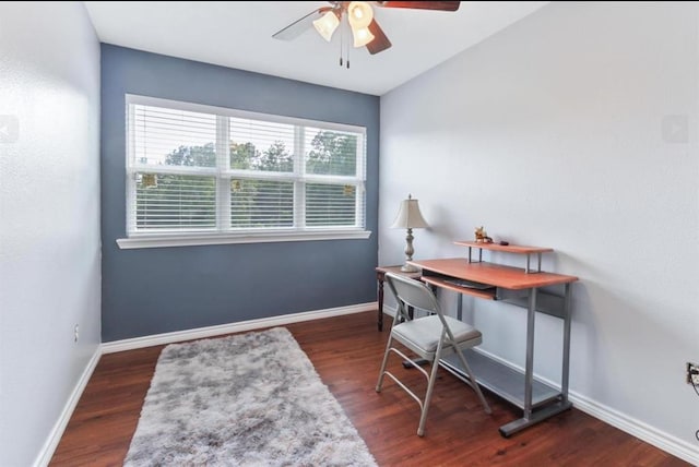 office area featuring wood finished floors, a ceiling fan, and baseboards