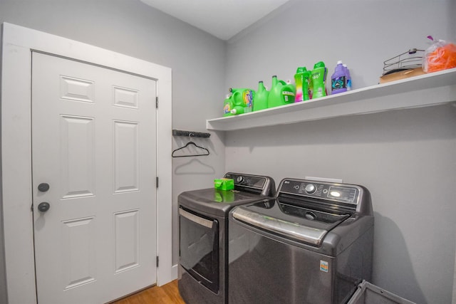 2000 Aggie Dr, Beaumont, TX 77713 - laundry room featuring washer and dryer and light wood-style flooring