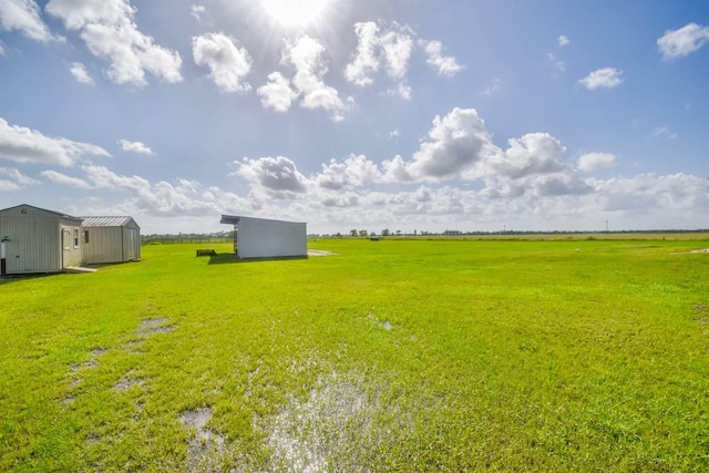 2000 Aggie Dr, Beaumont, TX 77713 - view of grassy yard featuring a shed