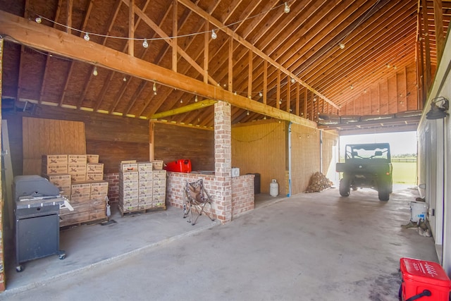 2000 Aggie Dr, Beaumont, TX 77713 - miscellaneous room featuring concrete flooring and vaulted ceiling