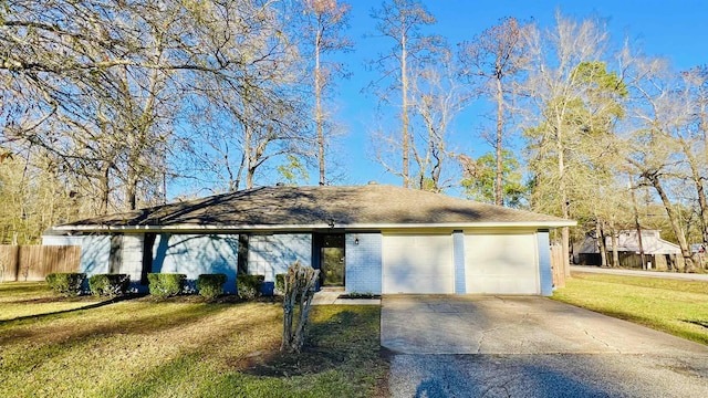 ranch-style house with a garage and a front yard