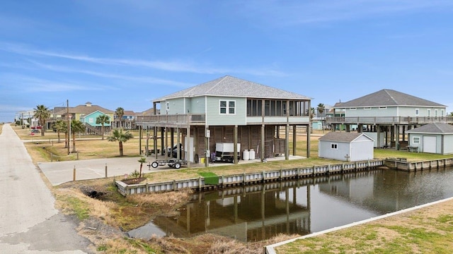 dock area featuring a patio area and a water view