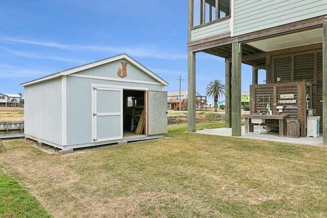 view of outdoor structure with a lawn