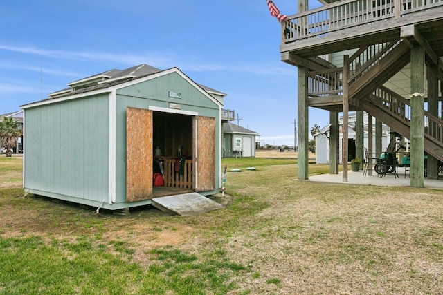 view of outbuilding with a lawn