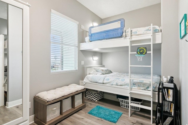 bedroom with light wood-type flooring