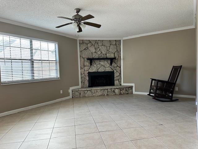 unfurnished living room with ceiling fan, light tile patterned floors, and crown molding