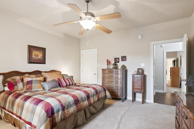 bedroom featuring ceiling fan and light carpet